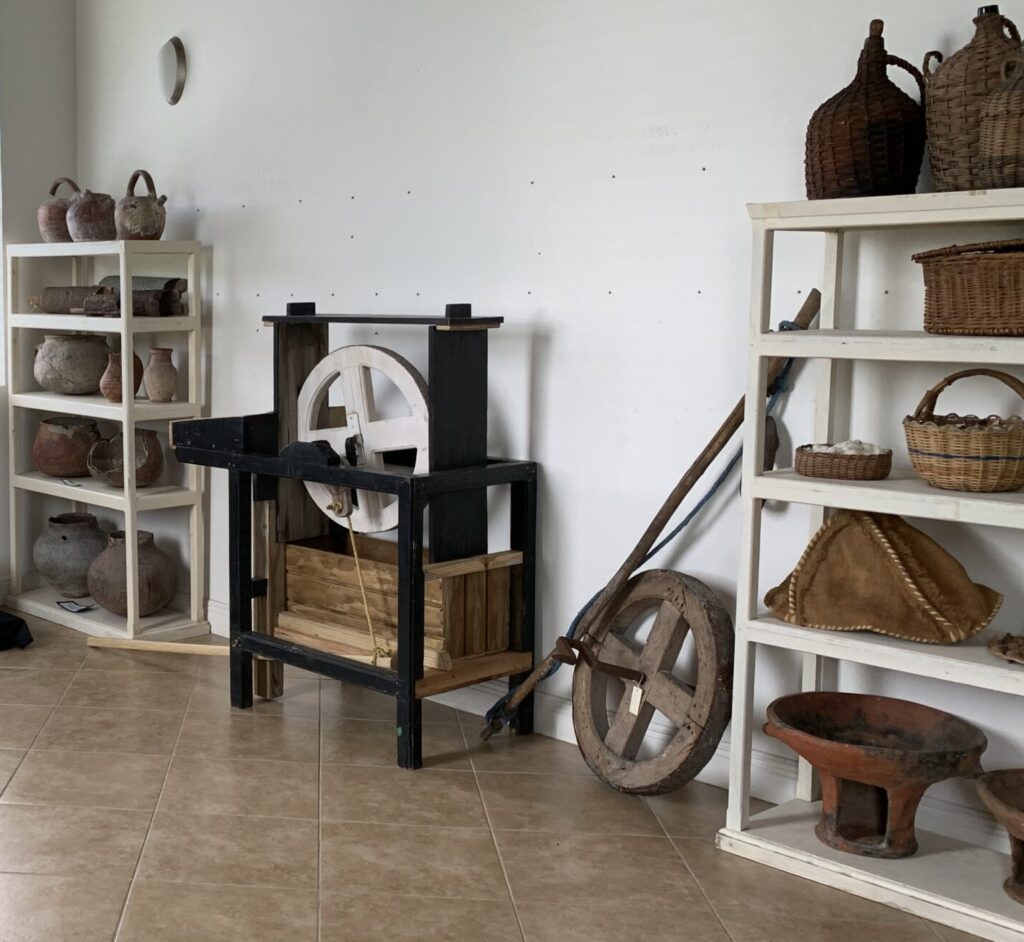 Jars, graters, cassava grinder, baskets and coal pots